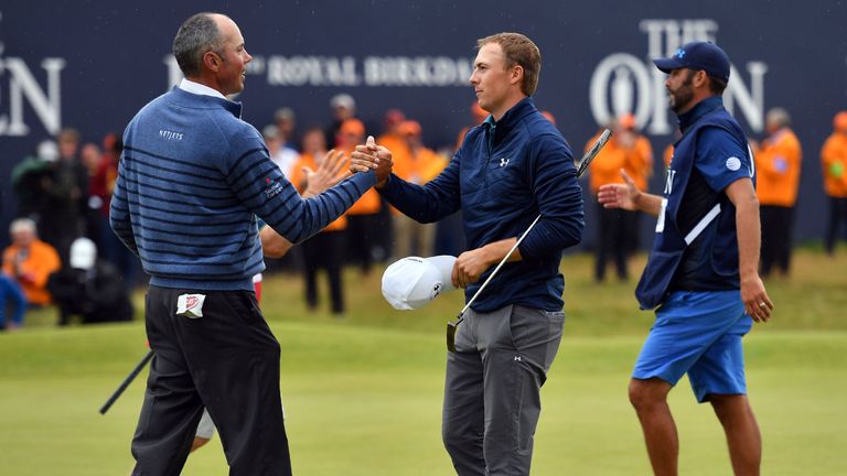 Kuchar shakes hands with Spieth on the 18th green