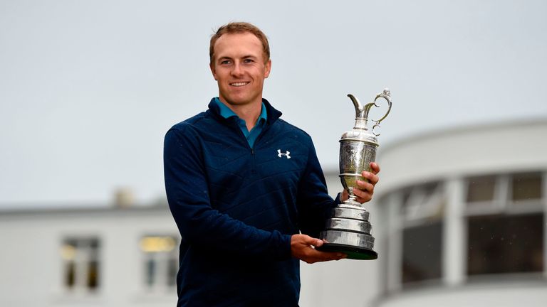 US golfer Jordan Spieth poses for pictures with the Claret Jug, the trophy for the Champion golfer of the year, in front of the Art-Deco-style clubhouse, a