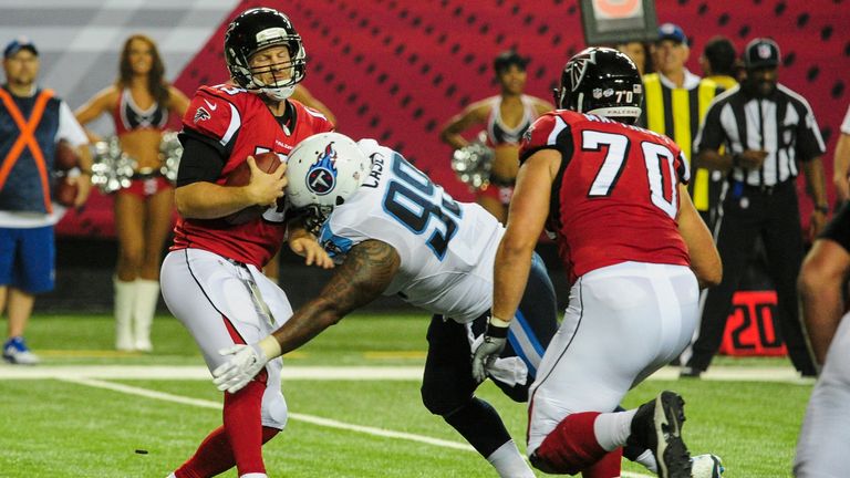 ATLANTA, GA - AUGUST 23: T.J. Yates #13 of the Atlanta Falcons is sacked by Jurrell Casey #99 of the Tennessee Titans in the second half of a preseason gam