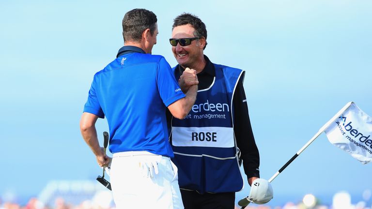 ABERDEEN, SCOTLAND - JULY 13:  Justin Rose of England celebrates on the 18th green with his caddie Mark Fulcher after winning the Aberdeen Asset Management