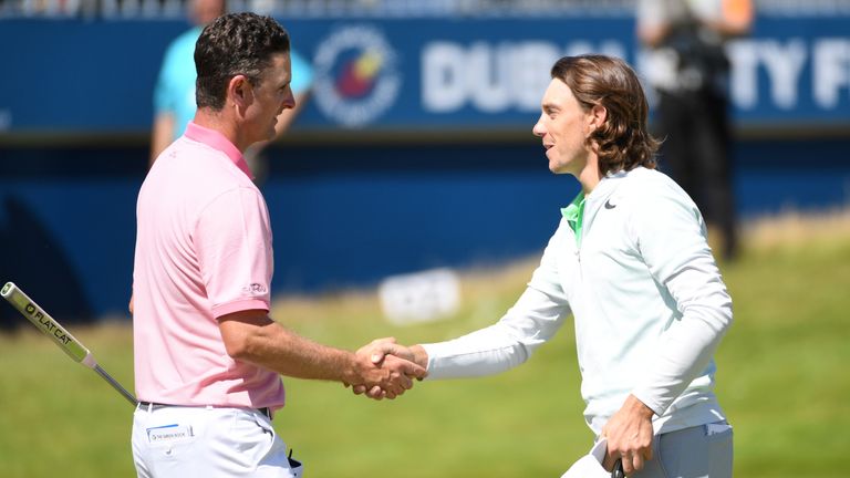 Justin Rose of England shakes hands with Tommy Fleetwood of England on the 18th green during day three of the Dubai Duty Free Irish Open