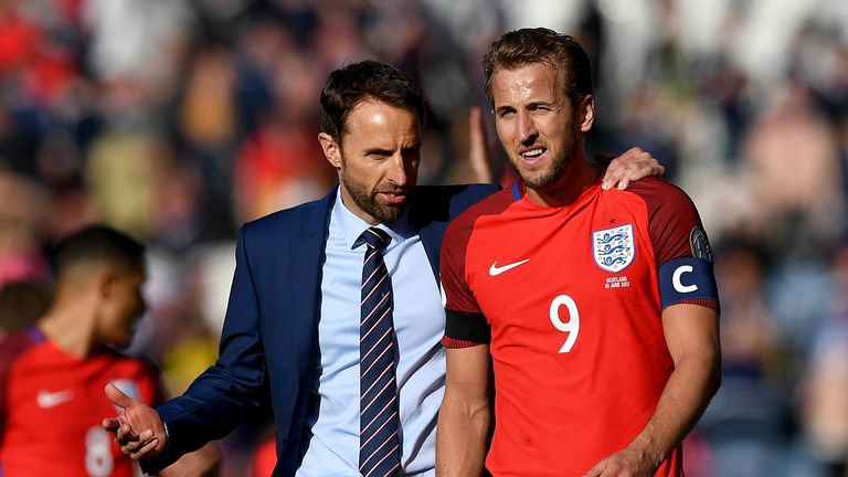 GLASGOW, SCOTLAND - JUNE 10:  Gareth Southgate, Manager of England and Harry Kane of England speak to each other after the FIFA 2018 World Cup Qualifier be