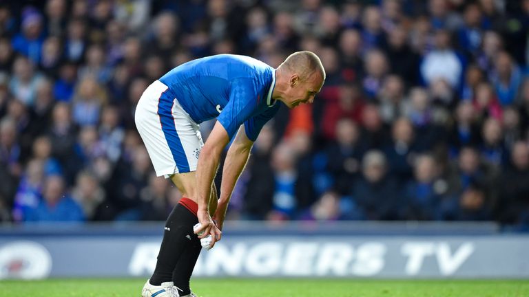 Miller collects the paper at Ibrox 