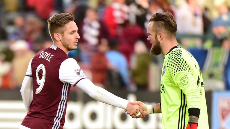 COMMERCE CITY, CO - NOVEMBER 27:  Kevin Doyle #9 of Colorado Rapids congratulates Stefan Frei #24 of Seattle Sounders on a 1-0 victory to win the MLS Weste