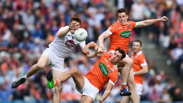 Kevin Feely of Kildare in action against Charlie Vernon, right, and Stephen Sheridan of Armagh 