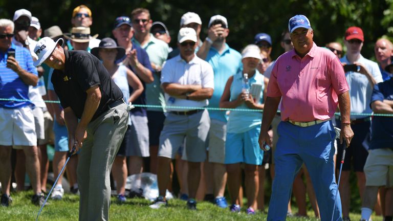 PEABODY, MA - JULY 2:  Kirk Triplett putts on the first green as  Kenny Perry looks on during the final round of the 2017 U.S. Senior Open Championship at 