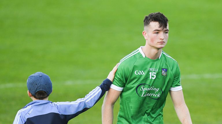 A young supporter pats Kyle Hayes of Limerick as he leaves the field after the GAA Hurling All-Ireland Senior Championship Round 1 match