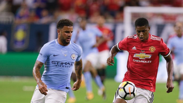 HOUSTON, TX - JULY 20:  Manchester United forward Marcus Rashford #19 brings the ball up the pitch as Kyle Walker #2 of Manchester City defends in the firs