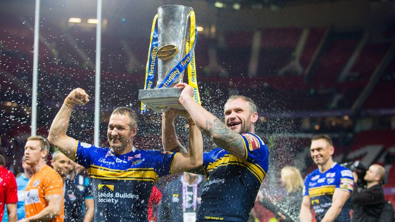 Leeds Rhinos v Wigan Warriors - Leeds captain Kevin Sinfield (R) soaks Danny McGuire (L) and Jamie Peacock (centre) in champagne.