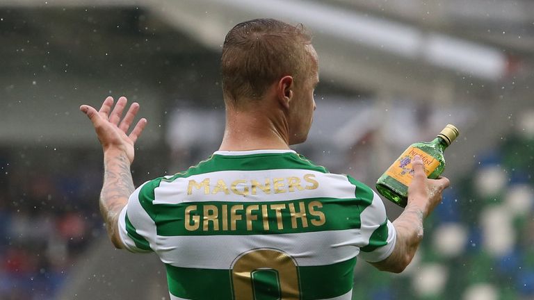 Celtic's Leigh Griffiths holds a glass bottle thrown at him from the stands during the UEFA Champions League Qualifying, Second Round, First Leg match at W