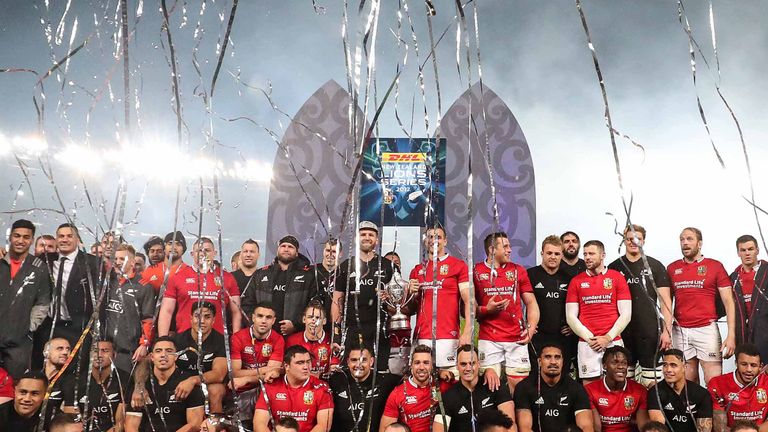 Lions and New Zealand on the podium after at the presentation of the series trophy.