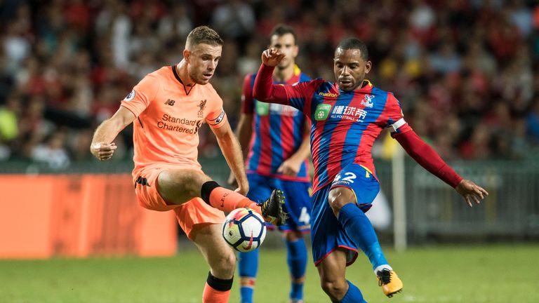Liverpool's Jordan Henderson (L) fights for the ball with Crystal Palace's Jason Puncheon (R) during  the Premier League Asia Trophy clash in Hong Kong