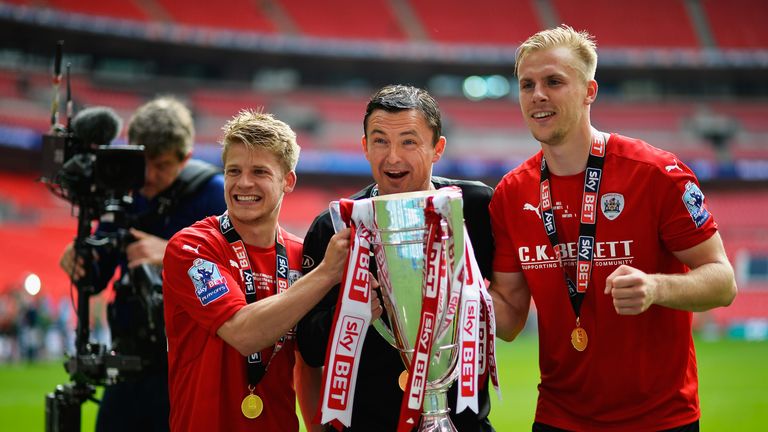 LONDON, ENGLAND - MAY 29:  Lloyd Isgrove of Barnsley FC, Manager of Barnsley FC, Paul Heckingbottom and Marc Roberts of Barnsley FC celebrate after wiining