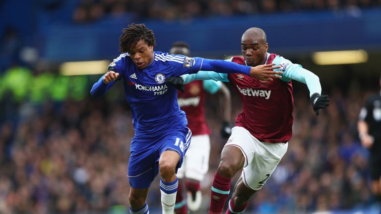 Loic Remy of Chelsea and Angelo Ogbonna Obinza of West Ham United compete for the ball
