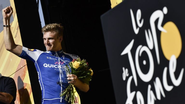 Marcel Kittel celebrates on the podium after his narrow stage seven win