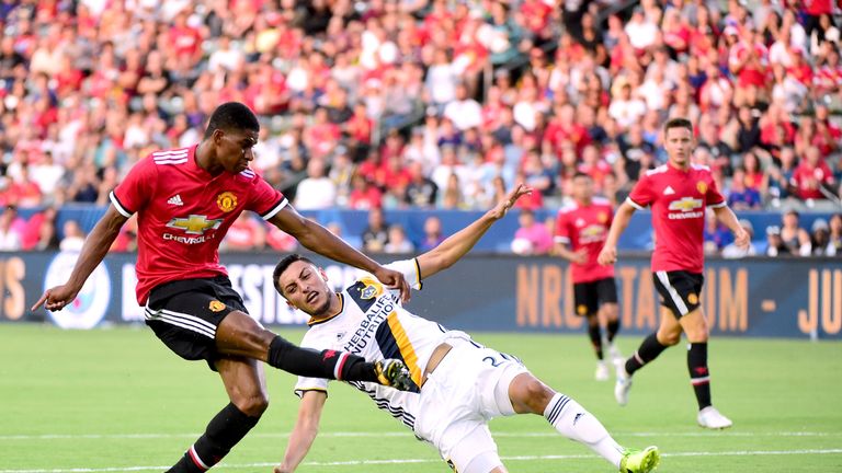 CARSON, CA - JULY 15:  Marcus Rashford #19 of Manchester United scores his second goal of the game past Hugo Arellano #21 of Los Angeles Galaxy to take a 2