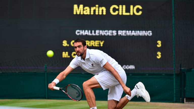 Croatia's Marin Cilic returns against US player Sam Querrey during their men's singles semi-final match on the eleventh day of the 2017 Wimbledon Champions