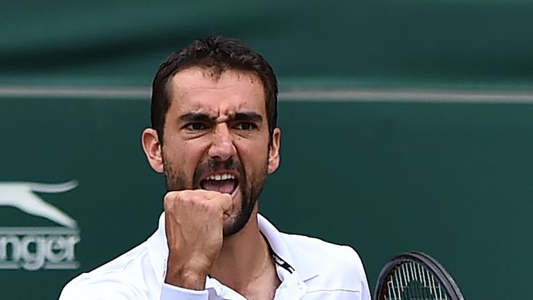 Croatia's Marin Cilic reacts after winning a point against US player Sam Querrey during their men's singles semi-final match on the eleventh day of the 201