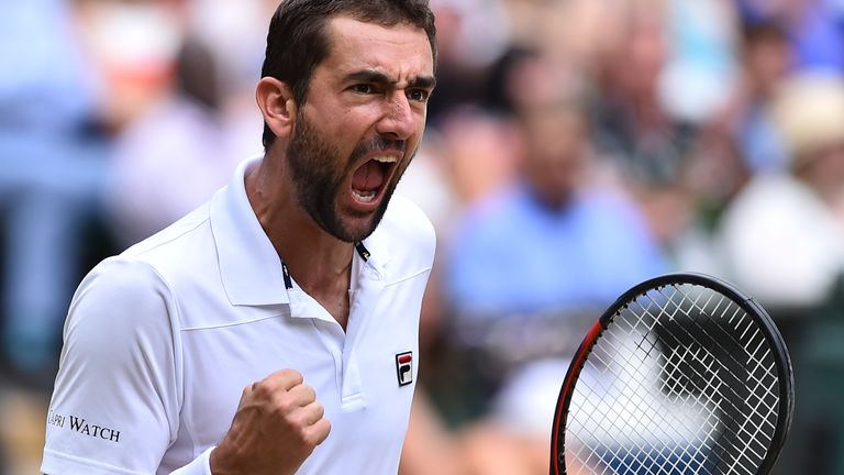 Croatia's Marin Cilic reacts after breaking the serve of US player Sam Querrey in the second set of their men's singles semi-final match on the eleventh da
