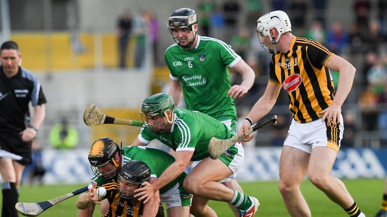 Mark Bergin passes the sliothar to his Kilkenny team mate Liam Blanchfield as he comes under pressure from Limerick players