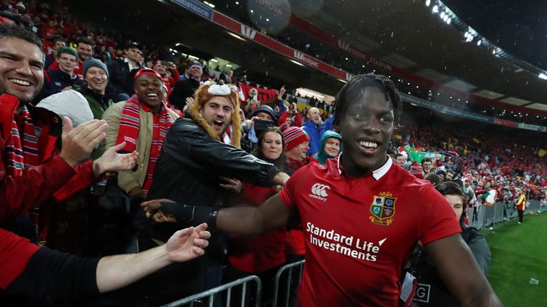 Maro Itoje celebrates with supporters after the British & Irish Lions' win in the second Test