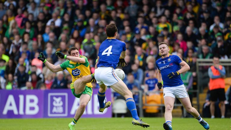 Martin Reilly of Donegal has his shot blocked by Barry Gilleran of Longford during the GAA Football All-Ireland Senior Championship Round 2A match