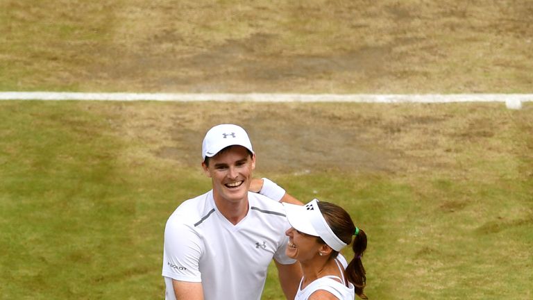 LONDON, ENGLAND - JULY 16:  Jamie Murray of Great Britain and partner Martina Hingis of Switzerland celebrate championship point and victory during the Mix
