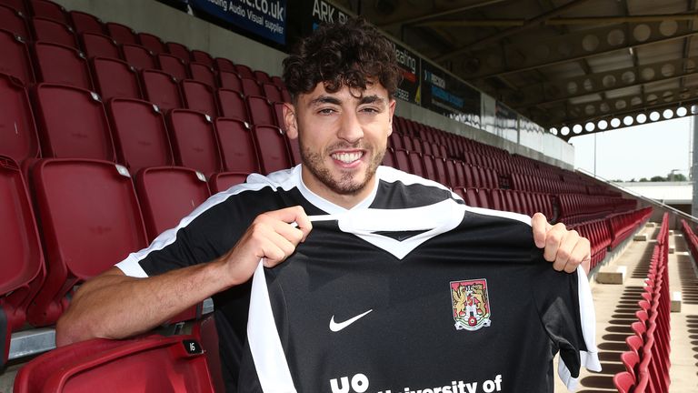 NORTHAMPTON, ENGLAND - JULY 18:  New Northampton Town signing Matt Crooks poses with a shirt during a photo call at Sixfields on July 18, 2017 in Northampt