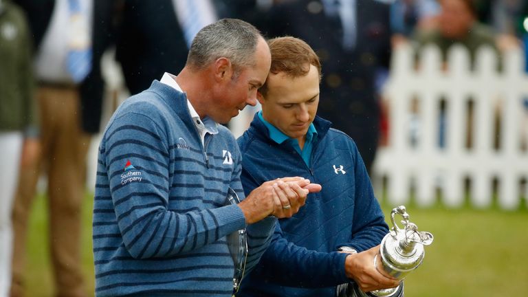 SOUTHPORT, ENGLAND - JULY 23:  Jordan Spieth of the United States holds the Claret Jug as he is congratulated by Matt Kuchar of the United States on the 18