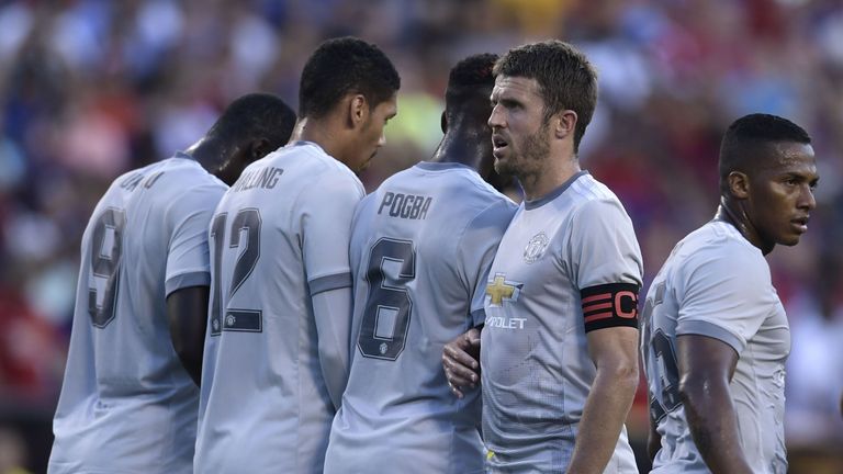 Captian Michael Carrick (2R) of Manchester United looks on during their International Champions Cup (ICC) football match against Barcelona on July 26, 2017