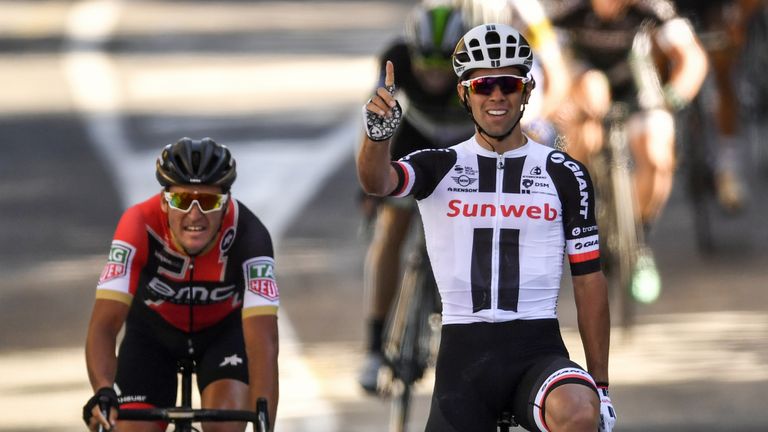 Michael Matthews celebrates as he crosses the line ahead of Greg Van Avermaet