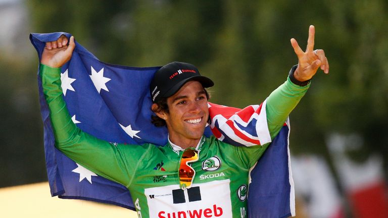Australia's Michael Matthews celebrates his green jersey of best sprinter on the podium at the end of the 103 km twenty-first and last stage