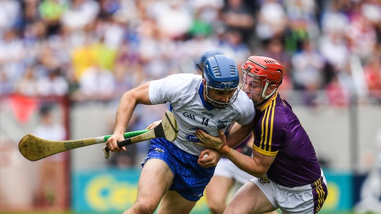Michael Walsh of Waterford in action against Willie Devereux of Wexford during the GAA Hurling All-Ireland Senior Championship Quarter-Final match 