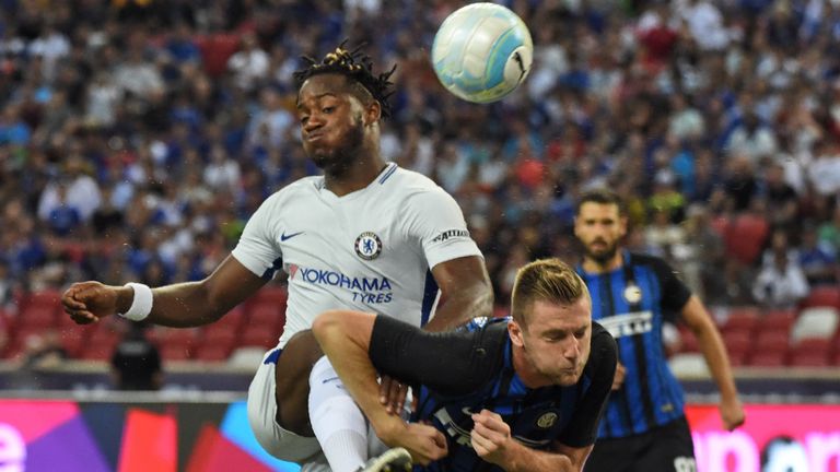 Chelsea's Michy Batshuayi (L) fights for the ball with Inter Milan's Danilo D'Ambrosio during their International Champions Cup football match in Singapore