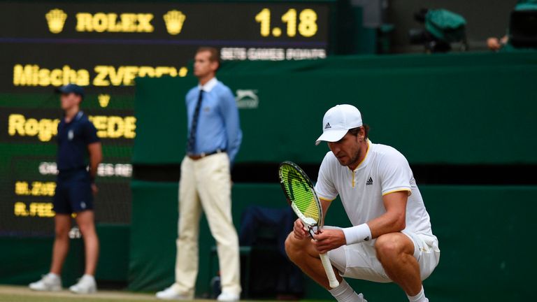 Germany's Mischa Zverev reacts after a point against Switzerland's Roger Federer during their men's singles third round match on the sixth day of the 2017 