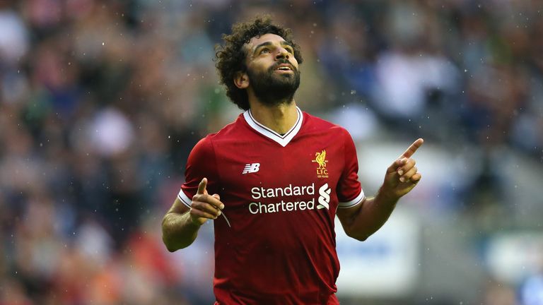 WIGAN, ENGLAND - JULY 14:  Mohamed Salah of Liverpool celebrates after scoring their first goal during the pre-season friendly match between Wigan Athletic