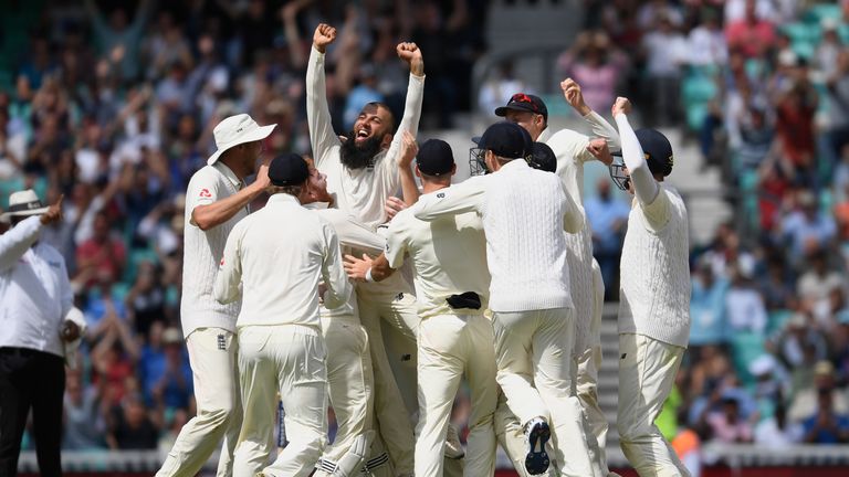 Moeen Ali of England celebrates with team mates after completing his hat trick to give England victory during the 3rd Investec 