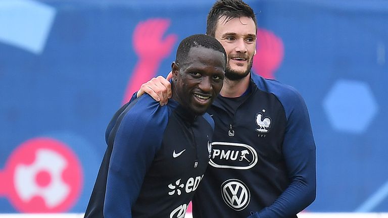 France's midfielder Moussa Sissoko is congratueld by France's goalkeeper Hugo Lloris at the end of a training session in Clairefontaine en Yvelines