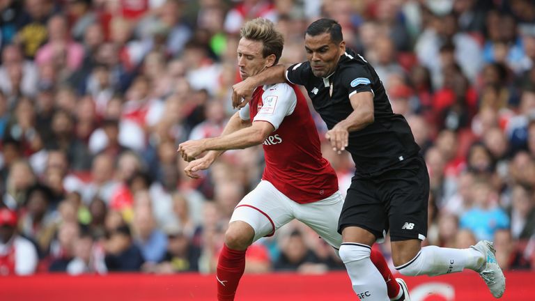 Nacho Monreal battles with Gabriel Mercado during Arsenal's 2-1 defeat