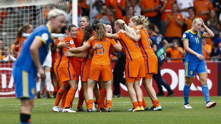 Dutch players celebrate after winning the UEFA Womens Euro 2017 football match between the Netherlands and Sweden at the De Vijverbeg stadium in Doetinchem