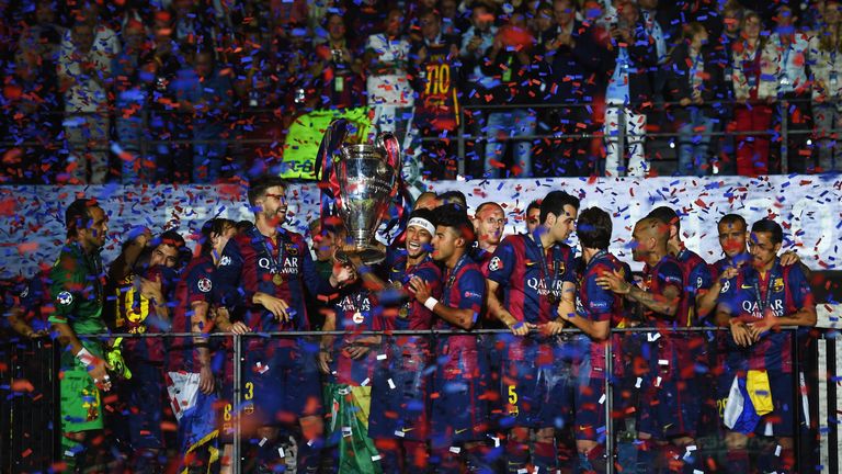 BERLIN, GERMANY - JUNE 06: Neymar of Barcelona lifts the trophy as he celebrates victory with team mates after the UEFA Champions League Final