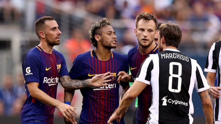 Neymar #11 of Barcelona and Claudio Marchisio #8 of Juventus exchange words in the first half during the International Champions Cup clash