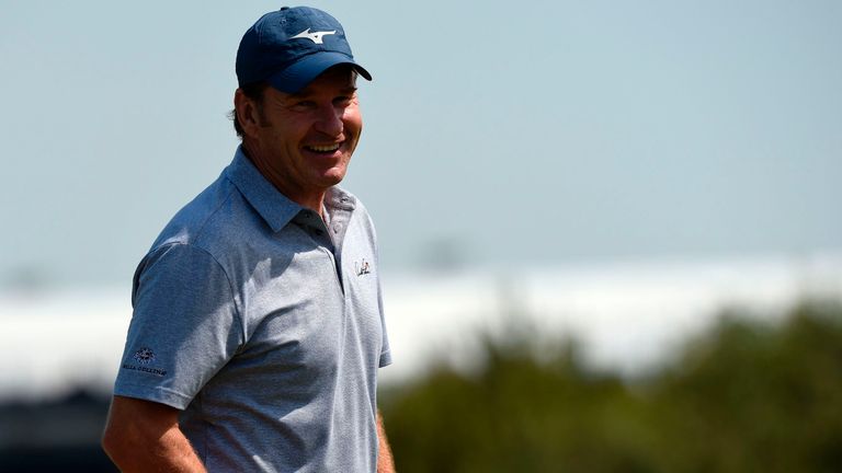 England's Nick Faldo smiles as he arrives on the 14th green during a practice round at Royal Birkdale golf course near Southport 
