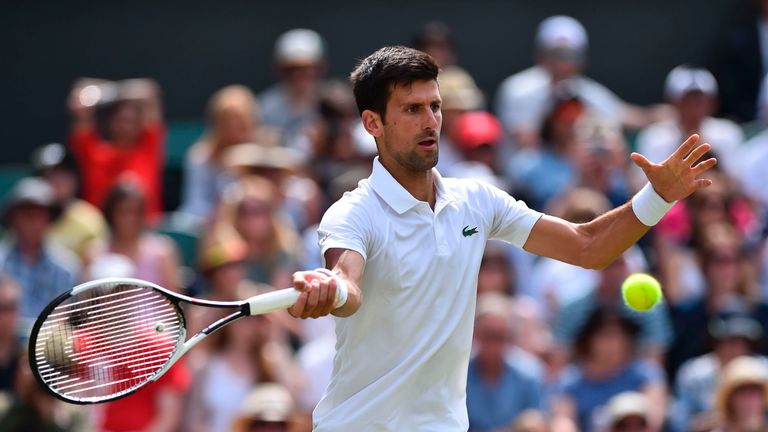 Novak Djokovic returns against Slovakia's Martin Klizan