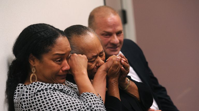 O.J. Simpson's sister Shirley Baker, middle, daughter Arnelle Simpson, left, and friend Tom Scotto react during the hearing