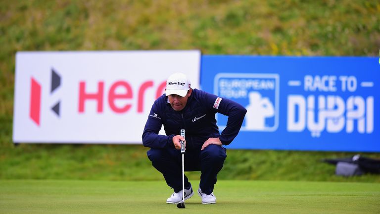 Padraig Harrington lines up a putt on the fourth green during the third round of the Scottish Open