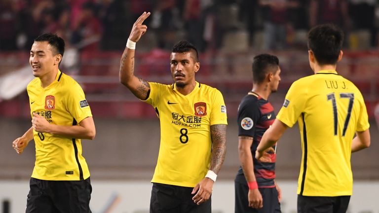 Guangzhou Evergrande's midfielder Paulinho (C) celebrates his goal during the AFC Champions League football match between Japan's Kashima Antlers and China