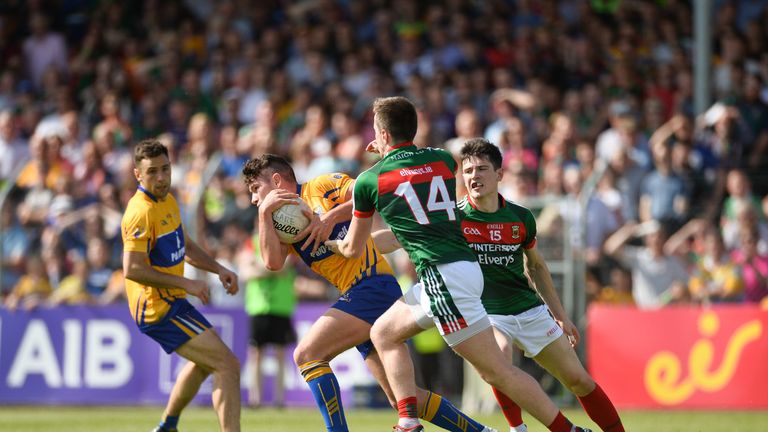 Pearse Lillis of Clare in action against Cillian O'Connor, left, and Conor Loftus of Mayo 
