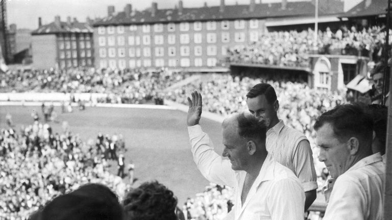 24th August 1957:  CHECK HI-RES IF SUPPLYING DIGITALLY England captain Peter May (1929 - 1994) salutes the crowd after leading England to an overwhelming v