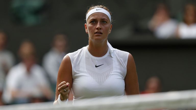 Czech Republic's Petra Kvitova reacts against Sweden's Johanna Larsson during their women's singles first round match on the first day of the 2017 Wimbledo